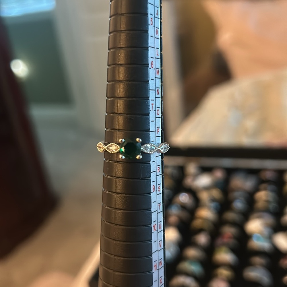 Womans .925 green Zirconia with white ones on side .